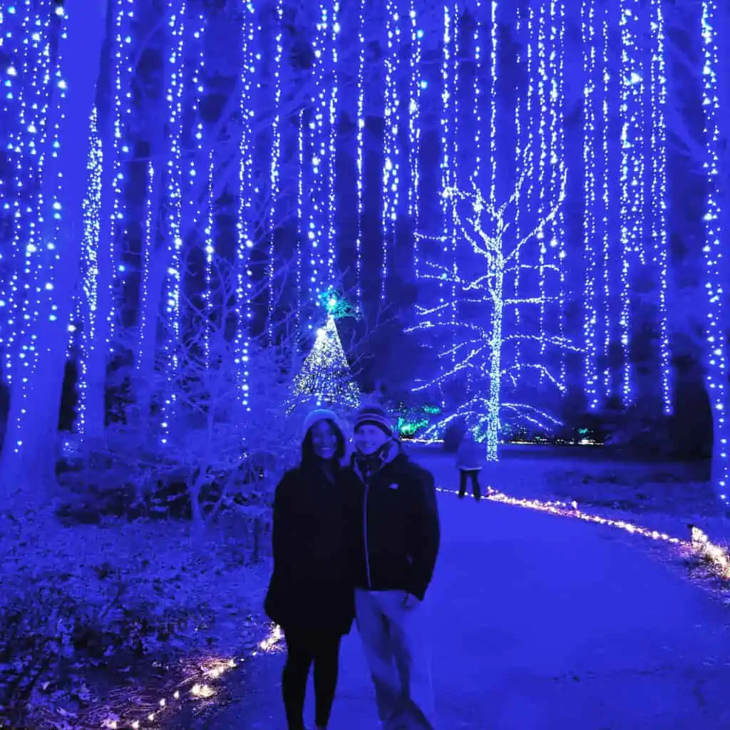 Alexandrea Sumuel Groves and her husband visiting the Garden of Lights at Norfolk Botanical Gardens.