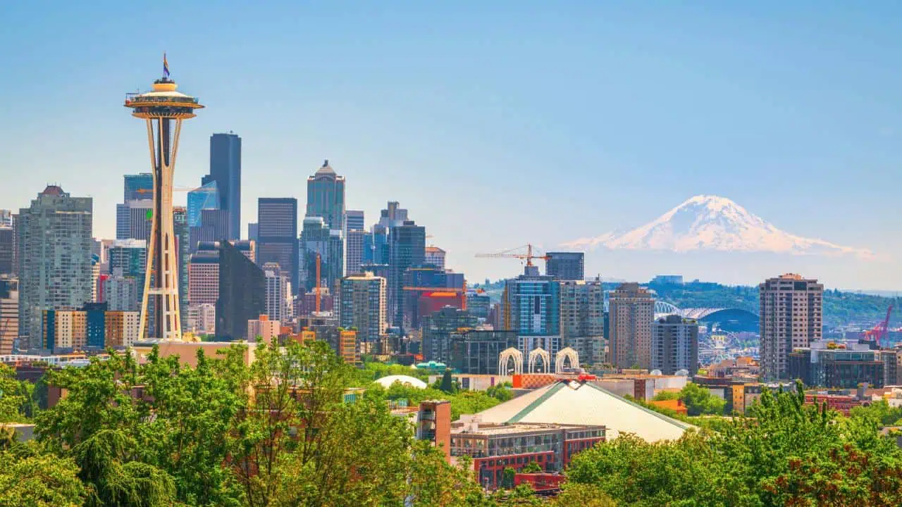 A daytime view of downtown Seattle and the Space Needle with Mt. Ranier in the background.