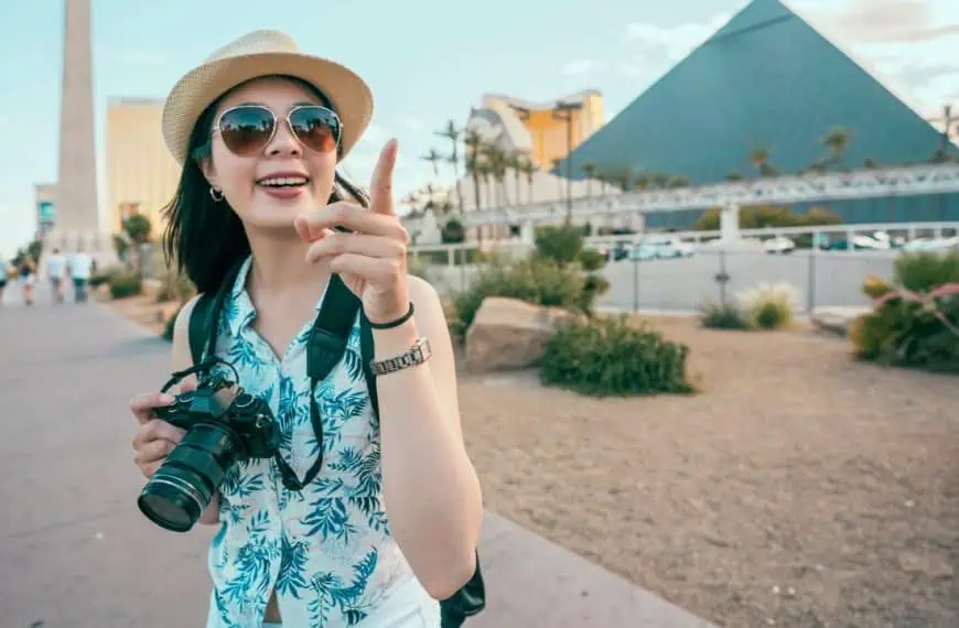 Woman making photo smiling at pyramids, Las Vegas