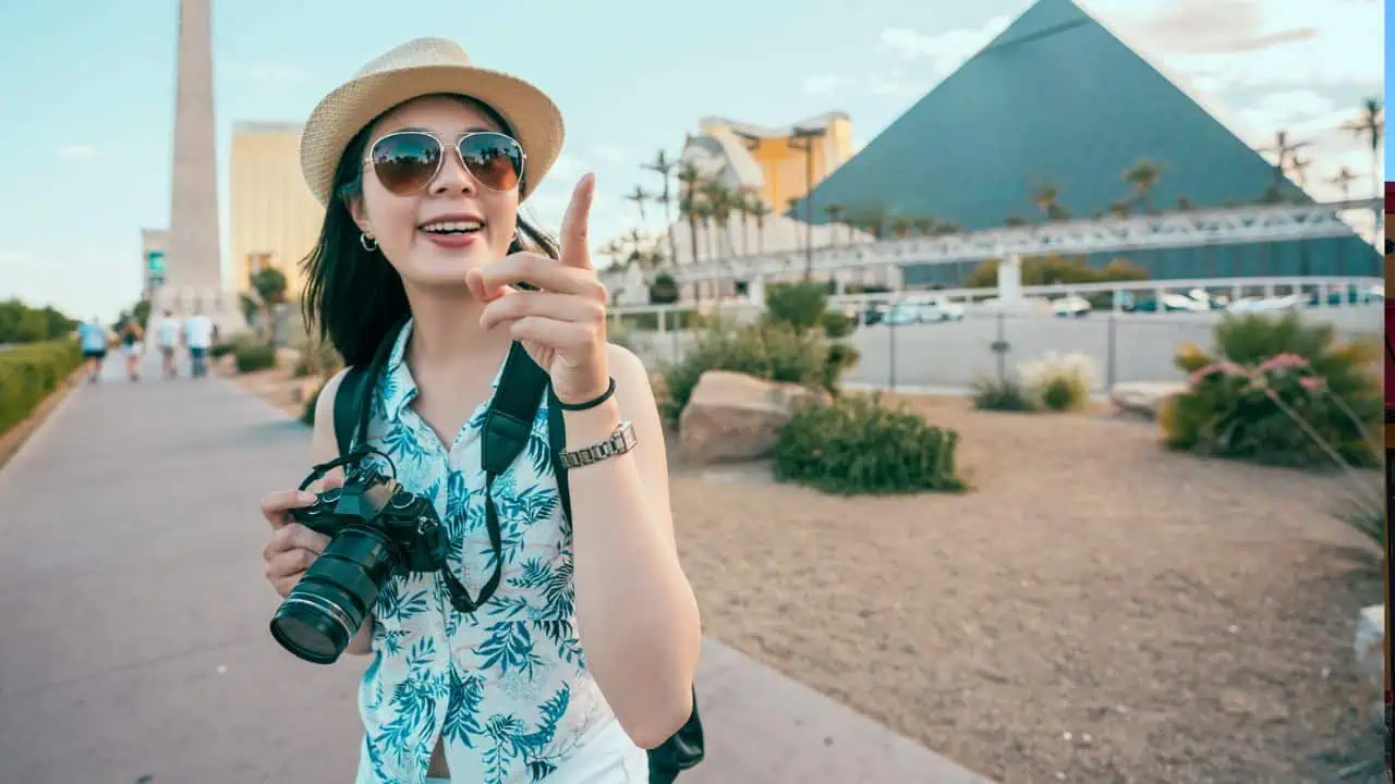 Woman making photo smiling at pyramids, Las Vegas