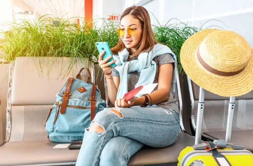 Woman waiting in airport on phone