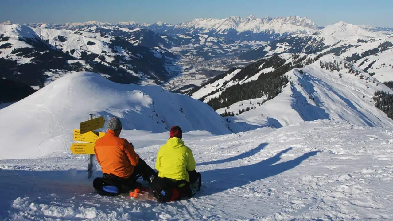 Tourists winter mountain hiking